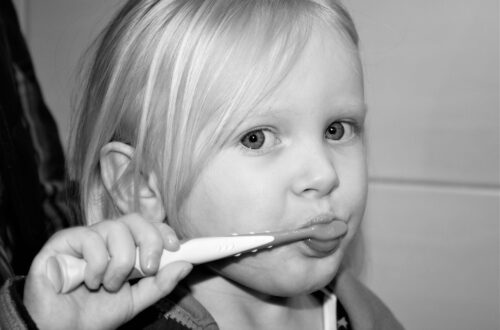 Child brushing teeth, featured image teach your child hygiene