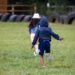 Children running in field. Image for how to survive summer holidays
